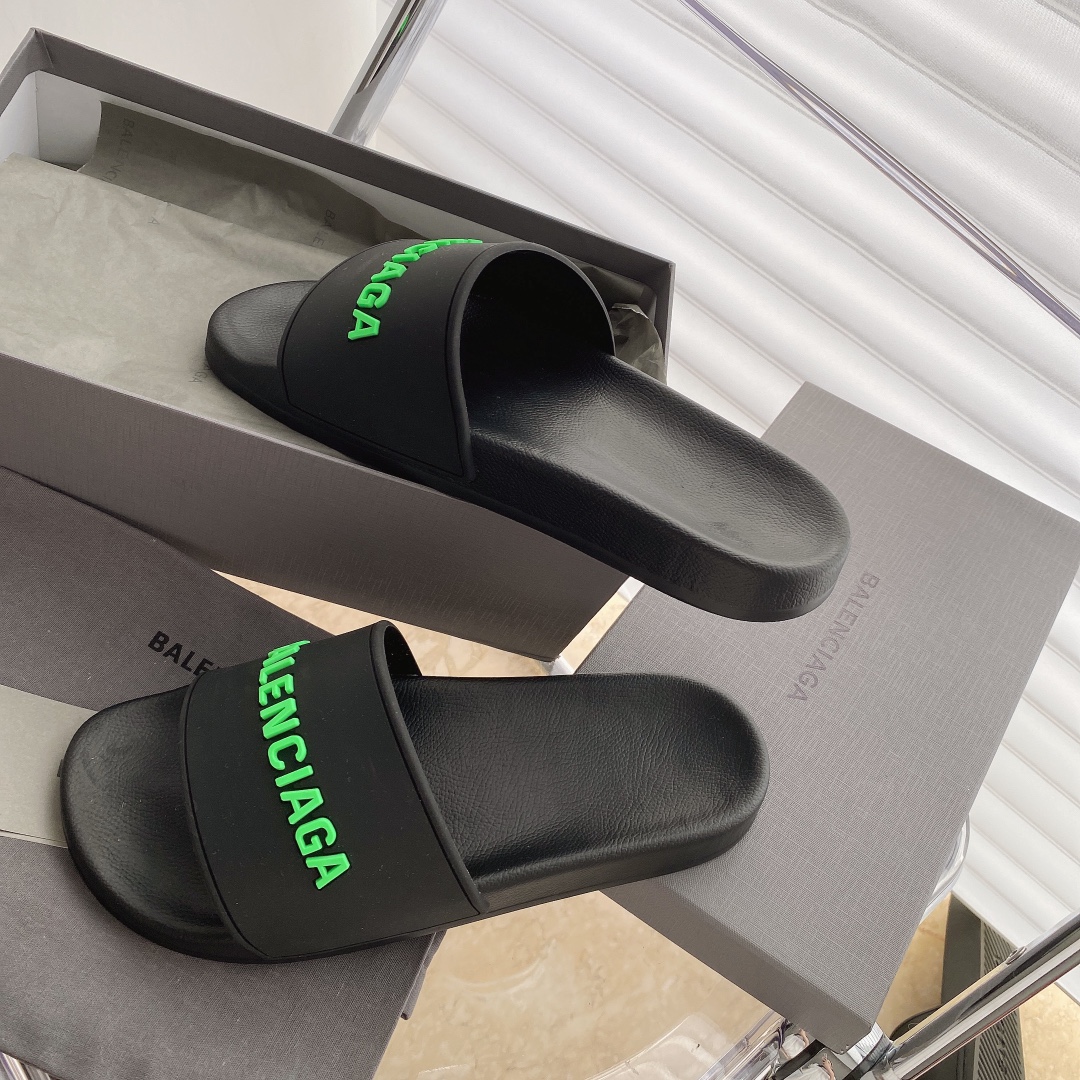 Balenciaga Pool Slides in black with green logo