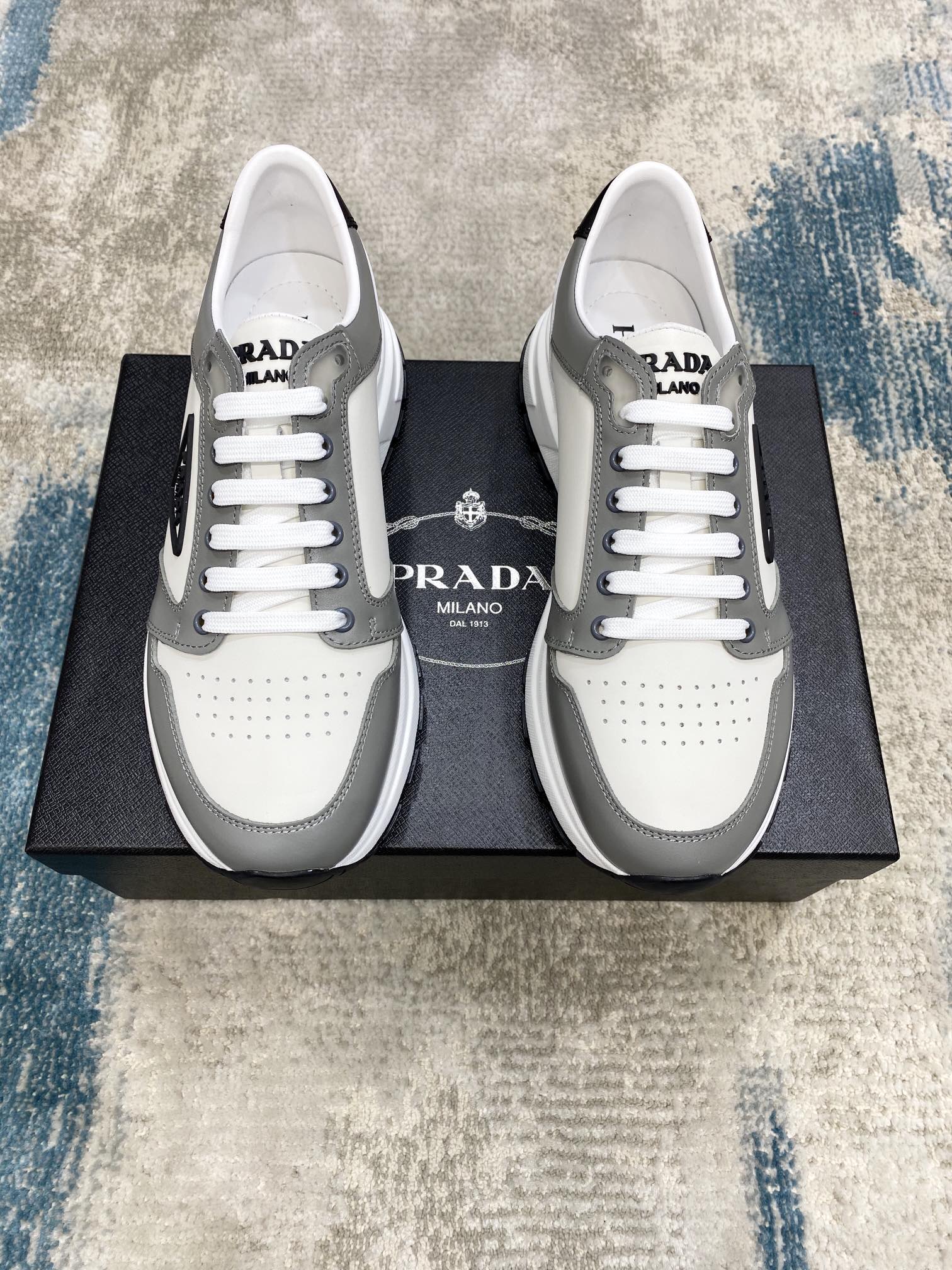 Prada Leisure Sneaker in White with Grey