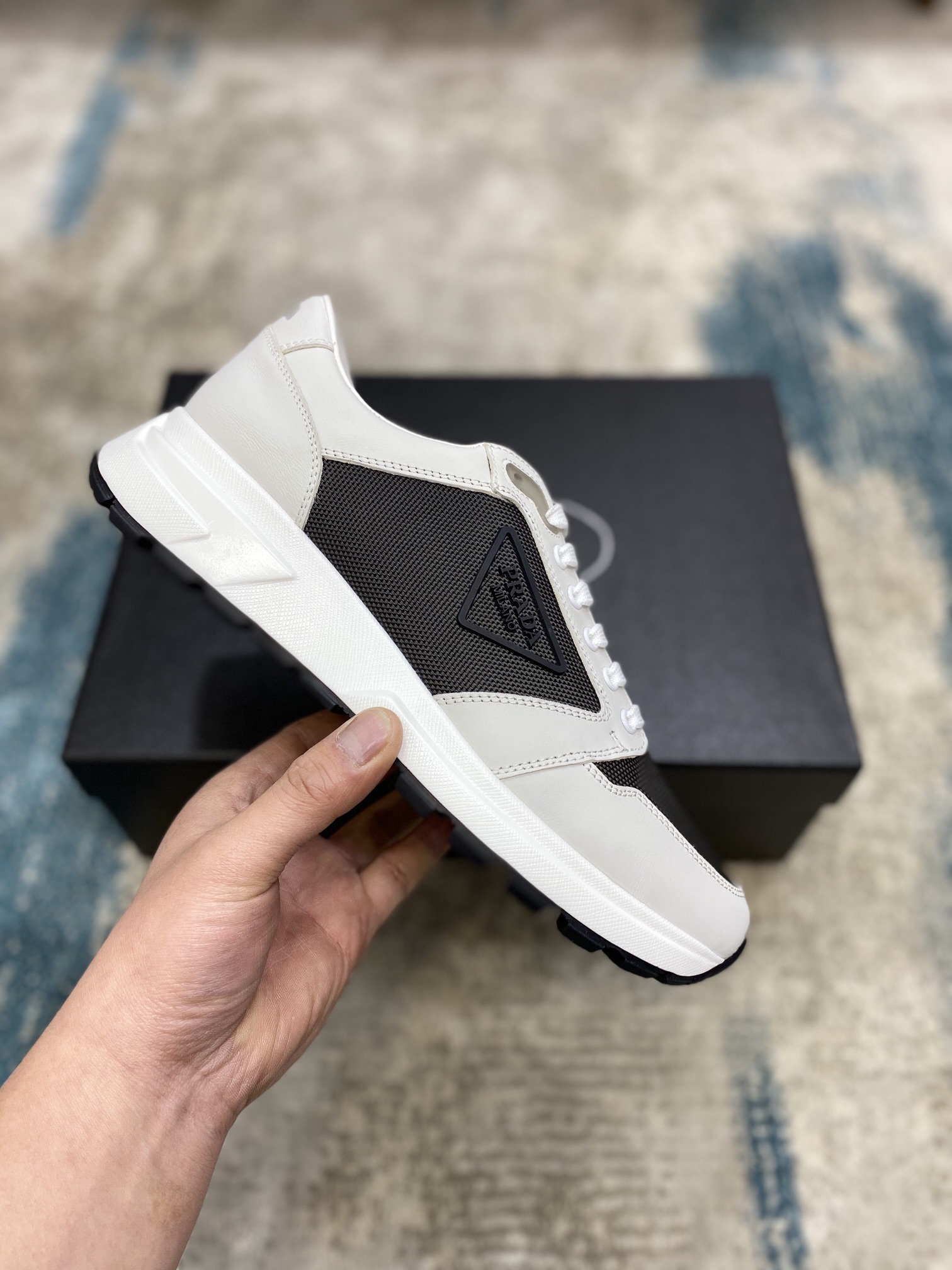 Prada Leisure Sneaker in White with Black